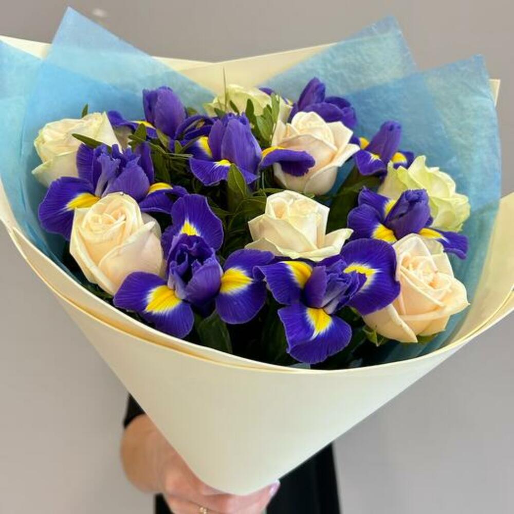 A bouquet of delicate roses and bright irises