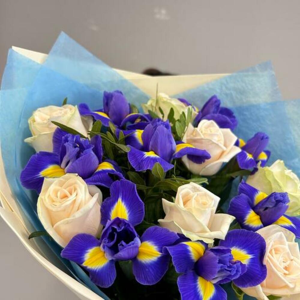 A bouquet of delicate roses and bright irises