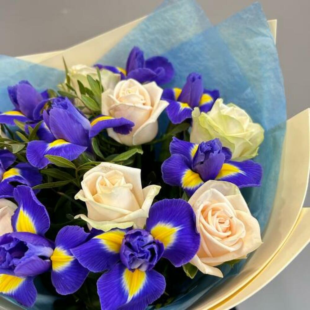 A bouquet of delicate roses and bright irises