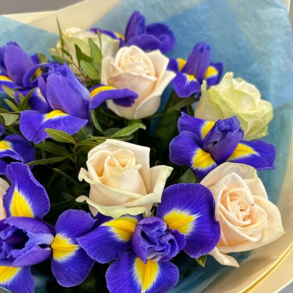 A bouquet of delicate roses and bright irises